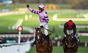 17 March 2023; Jockey Harry Cobden, left, celebrates on Stay Away Fay after winning the Albert Bartlett Novices' Hurdle during day four of the Cheltenham Racing Festival at Prestbury Park in Cheltenham, England. Photo by Seb Daly/Sportsfile