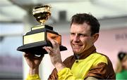 17 March 2023; Winning jockey Paul Townend celebrates with the Gold Cup after Galopin Des Champs had won the Boodles Cheltenham Gold Cup Chase during day four of the Cheltenham Racing Festival at Prestbury Park in Cheltenham, England. Photo by Harry Murphy/Sportsfile