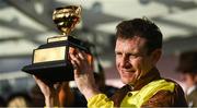 17 March 2023; Winning jockey Paul Townend celebrates with the Gold Cup after Galopin Des Champs had won the Boodles Cheltenham Gold Cup Chase during day four of the Cheltenham Racing Festival at Prestbury Park in Cheltenham, England. Photo by Harry Murphy/Sportsfile