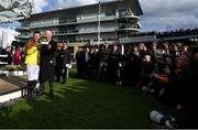 17 March 2023; Jockey Paul Townend and trainer Willie Mullins are the centre of photographer's attentions as they were presented with the Gold Cup after winning the Boodles Cheltenham Gold Cup Chase during day four of the Cheltenham Racing Festival at Prestbury Park in Cheltenham, England. Photo by Seb Daly/Sportsfile