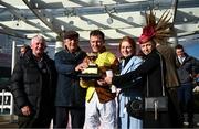 17 March 2023; Jockey Paul Townend celebrates, with family, after winning the Boodles Cheltenham Gold Cup Chase during day four of the Cheltenham Racing Festival at Prestbury Park in Cheltenham, England. Photo by Harry Murphy/Sportsfile