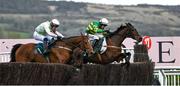 17 March 2023; Impervious, right, with Brian Hayes up, jump the last, ahead of Allegorie De Vassy, with Paul Townend up, who finished second, on their way to winning the Mrs Paddy Power Mares' Chase during day four of the Cheltenham Racing Festival at Prestbury Park in Cheltenham, England. Photo by Harry Murphy/Sportsfile