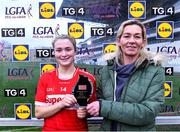 17 March 2023; Eimear Kiely of Cork is presented with the Player of the Match award by Lorraine Coomey, Store Manager, Lidl Cork City Churchfield, after the Lidl Ladies National Football League Division 1 match between Cork and Kerry at Páirc Uí Chaoimh in Cork. Photo by Piaras Ó Mídheach/Sportsfile