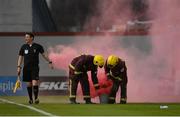 17 March 2023; Civil Defence members remove flares from the pitch during the SSE Airtricity Men's Premier Division match between Shamrock Rovers and St Patrick's Athletic at Tallaght Stadium in Dublin. Photo by Tyler Miller/Sportsfile