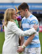 17 March 2023; Noreen Wilson, mother of Gonzaga College captain Paul Wilson, consoles Blackrock College captain Oliver Coffey as he presents her with flowers after his side's defeat in the Bank of Ireland Leinster Schools Senior Cup Final match between Gonzaga College and Blackrock Collegee at RDS Arena in Dublin. Photo by Sam Barnes/Sportsfile