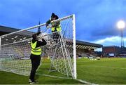17 March 2023; Bohemians groundsmen Paul Byrne and Jamie McGivern prepare the nets before  the SSE Airtricity Men's Premier Division match between Bohemians and UCD at Dalymount Park in Dublin. Photo by Sam Barnes/Sportsfile