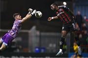 17 March 2023; Jonathan Afolabi of Bohemians in action against UCD goalkeeper Kian Moore during the SSE Airtricity Men's Premier Division match between Bohemians and UCD at Dalymount Park in Dublin. Photo by Sam Barnes/Sportsfile