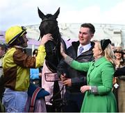 17 March 2023; Jockey Paul Townend, groom Adam Connolly and the owner Audrey Turley after Galopin Des Champs had won the Boodles Cheltenham Gold Cup Chase during day four of the Cheltenham Racing Festival at Prestbury Park in Cheltenham, England. Photo by Harry Murphy/Sportsfile