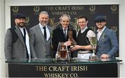 17 March 2023; Leading jockey Paul Townend is presented with the Ruby Walsh trophy by former jockey Ruby Walsh and representatives from The Craft Irish Whiskey Co during day four of the Cheltenham Racing Festival at Prestbury Park in Cheltenham, England. Photo by Seb Daly/Sportsfile