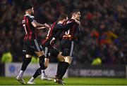 17 March 2023; Paddy Kirk of Bohemians, celebrates with team-mates, Declan McDaid, left, and Kacper Radkowski after scoring his side's first goal  during the SSE Airtricity Men's Premier Division match between Bohemians and UCD at Dalymount Park in Dublin. Photo by Sam Barnes/Sportsfile