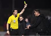 17 March 2023; Referee Robert Harvey shows a yellow card to Bohemians manager Declan Devine during the SSE Airtricity Men's Premier Division match between Bohemians and UCD at Dalymount Park in Dublin. Photo by Sam Barnes/Sportsfile