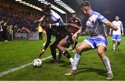 17 March 2023; Jonathan Afolabi of Bohemians in action against Daniel Norris, left, and Adam Wells of UCD during the SSE Airtricity Men's Premier Division match between Bohemians and UCD at Dalymount Park in Dublin. Photo by Sam Barnes/Sportsfile