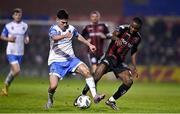 17 March 2023; James Akintunde of Bohemians  in action against Brendan Barr of UCD during the SSE Airtricity Men's Premier Division match between Bohemians and UCD at Dalymount Park in Dublin. Photo by Sam Barnes/Sportsfile