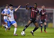 17 March 2023; James Akintunde of Bohemians  in action against Brendan Barr of UCD during the SSE Airtricity Men's Premier Division match between Bohemians and UCD at Dalymount Park in Dublin. Photo by Sam Barnes/Sportsfile