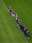 18 March 2023; The Tipperary squad and management stand during a minutes silence to honour the late Liam Kearns before the Allianz Football League Division 3 match between Tipperary and Offaly at FBD Semple Stadium in Thurles, Tipperary. Photo by Ray McManus/Sportsfile