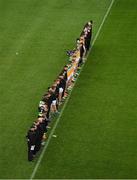 18 March 2023; The Offaly squad and management, stand during a minutes silence to honour the late Liam Kearns, before the Allianz Football League Division 3 match between Tipperary and Offaly at FBD Semple Stadium in Thurles, Tipperary. Photo by Ray McManus/Sportsfile