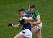 18 March 2023; Conor Cadell of Tipperary in action against Cian Donohoe of Offaly during the Allianz Football League Division 3 match between Tipperary and Offaly at FBD Semple Stadium in Thurles, Tipperary. Photo by Ray McManus/Sportsfile