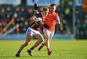 18 March 2023; Cian Hernon of Galway in action against Callum Cumiskey of Armagh during the Allianz Football League Division 1 match between Armagh and Galway at Box-It Athletic Grounds in Armagh. Photo by Ben McShane/Sportsfile