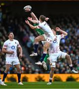 18 March 2023; Peter O'Mahony of Ireland contests a high ball with Jack van Poortvliet of England during the Guinness Six Nations Rugby Championship match between Ireland and England at Aviva Stadium in Dublin. Photo by Harry Murphy/Sportsfile