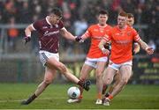 18 March 2023; Johnny Heaney of Galway has a shot on goal despite the attention of Ciaran Mackin of Armagh during the Allianz Football League Division 1 match between Armagh and Galway at Box-It Athletic Grounds in Armagh. Photo by Ben McShane/Sportsfile