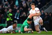 18 March 2023; Dan Sheehan of Ireland scores his side's first try despite the tackle of Manu Tuilagi, left, and Jack van Poortvliet of England during the Guinness Six Nations Rugby Championship match between Ireland and England at Aviva Stadium in Dublin. Photo by Harry Murphy/Sportsfile
