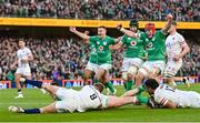 18 March 2023; Ireland players, from left, Jonathan Sexton, Caelan Doris and Josh van der Flier celebrate after teammate Dan Sheehan scores their side's first try during the Guinness Six Nations Rugby Championship match between Ireland and England at Aviva Stadium in Dublin. Photo by Ramsey Cardy/Sportsfile