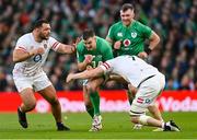 18 March 2023; Jonathan Sexton of Ireland is tackled by Jack Willis of England during the Guinness Six Nations Rugby Championship match between Ireland and England at Aviva Stadium in Dublin. Photo by Ramsey Cardy/Sportsfile