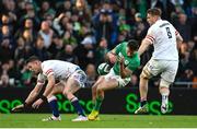 18 March 2023; Hugo Keenan of Ireland goes down after a tackle by Freddie Steward of England, resulting in a red card for Freddie Steward, during the Guinness Six Nations Rugby Championship match between Ireland and England at the Aviva Stadium in Dublin. Photo by Seb Daly/Sportsfile