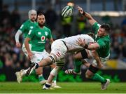 18 March 2023; Peter O'Mahony of Ireland is tackled by Jack Willis of England during the Guinness Six Nations Rugby Championship match between Ireland and England at the Aviva Stadium in Dublin. Photo by Seb Daly/Sportsfile