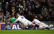 18 March 2023; Dan Sheehan of Ireland dives over to score his side's third try despite the tackle of Dan Cole of England during the Guinness Six Nations Rugby Championship match between Ireland and England at Aviva Stadium in Dublin. Photo by Harry Murphy/Sportsfile