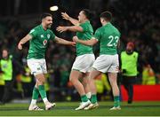 18 March 2023; Ireland players, from left, Conor Murray, James Lowe and Jimmy O'Brien celebrate after their side's win in the Guinness Six Nations Rugby Championship match between Ireland and England at the Aviva Stadium in Dublin. Photo by Seb Daly/Sportsfile