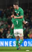 18 March 2023; Jonathan Sexton of Ireland, top, and Andrew Porter celebrate after their side's victory in the Guinness Six Nations Rugby Championship match between Ireland and England at the Aviva Stadium in Dublin. Photo by Seb Daly/Sportsfile