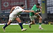 18 March 2023; Robbie Henshaw of Ireland evades the tackle of Jamie George of England during the Guinness Six Nations Rugby Championship match between Ireland and England at the Aviva Stadium in Dublin. Photo by Seb Daly/Sportsfile