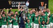 18 March 2023; Ireland players celebrate with the Six Nations trophy and Triple Crown trophy after the Guinness Six Nations Rugby Championship match between Ireland and England at Aviva Stadium in Dublin. Photo by Ramsey Cardy/Sportsfile