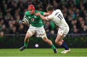 18 March 2023; Josh van der Flier of Ireland evades the tackle of Owen Farrell of England during the Guinness Six Nations Rugby Championship match between Ireland and England at the Aviva Stadium in Dublin. Photo by Seb Daly/Sportsfile