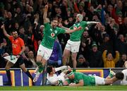 18 March 2023; Conor Murray of Ireland, left, and teammate Mack Hansen, right, celebrate after Dave Kilcoyne scores their side's fourth try during the Guinness Six Nations Rugby Championship match between Ireland and England at Aviva Stadium in Dublin. Photo by Harry Murphy/Sportsfile