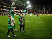 18 March 2023; Jonathan Sexton of Ireland celebrates with his children and the Six Nations trophy and Triple Crown trophy after the Guinness Six Nations Rugby Championship match between Ireland and England at Aviva Stadium in Dublin.  Photo by Harry Murphy/Sportsfile