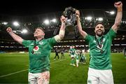 18 March 2023; Tadhg Furlong of Ireland, left, and Conor Murray celebrate with the Six Nations trophy after the Guinness Six Nations Rugby Championship match between Ireland and England at Aviva Stadium in Dublin. Photo by Harry Murphy/Sportsfile