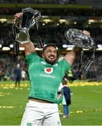 18 March 2023; Bundee Aki of Ireland celebrates with the Six Nations trophy and Triple Crown trophy after the Guinness Six Nations Rugby Championship match between Ireland and England at Aviva Stadium in Dublin. Photo by Harry Murphy/Sportsfile