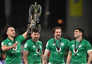 18 March 2023; Ireland players, from left, James Lowe, Hugo Keenan, Mack Hansen, and Jimmy O'Brien celebrate with the Six Nations Trophy after the Guinness Six Nations Rugby Championship match between Ireland and England at Aviva Stadium in Dublin. Photo by Harry Murphy/Sportsfile
