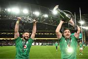 18 March 2023; Robbie Henshaw and Jack Conan of Ireland lift the trophies after their side's victory in the Guinness Six Nations Rugby Championship match between Ireland and England at Aviva Stadium in Dublin. Photo by Harry Murphy/Sportsfile