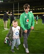 18 March 2023; Tommy Farrell, son of England captain Owen Farrell, left, with Gabriel Farrell, son of Ireland head coach Andy Farrell, after the Guinness Six Nations Rugby Championship match between Ireland and England at Aviva Stadium in Dublin. Photo by Harry Murphy/Sportsfile