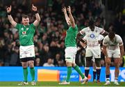 18 March 2023; Peter O'Mahony and Jack Conan of Ireland celebrate at the full-time whistle as Maro Itoje and Henry Slade of England react after the Guinness Six Nations Rugby Championship match between Ireland and England at the Aviva Stadium in Dublin. Photo by Seb Daly/Sportsfile
