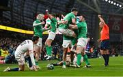 18 March 2023; Rob Herring of Ireland, hidden, celebrates with teammate Conor Murray and Cian Healy after scoring their side's fourth try during the Guinness Six Nations Rugby Championship match between Ireland and England at the Aviva Stadium in Dublin. Photo by Seb Daly/Sportsfile