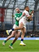 18 March 2023; Anthony Watson of England is tackled by Mack Hansen of Ireland during the Guinness Six Nations Rugby Championship match between Ireland and England at the Aviva Stadium in Dublin. Photo by Seb Daly/Sportsfile