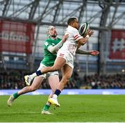 18 March 2023; Anthony Watson of England is tackled by Mack Hansen of Ireland during the Guinness Six Nations Rugby Championship match between Ireland and England at the Aviva Stadium in Dublin. Photo by Seb Daly/Sportsfile