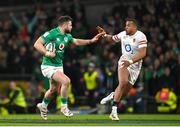 18 March 2023; Robbie Henshaw of Ireland in action against Anthony Watson of England during the Guinness Six Nations Rugby Championship match between Ireland and England at the Aviva Stadium in Dublin. Photo by Seb Daly/Sportsfile