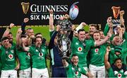 18 March 2023; Ireland captain Jonathan Sexton lifts the Six Nations trophy, as Garry Ringrose and James Ryan lift the Triple Crown trophy after the Guinness Six Nations Rugby Championship match between Ireland and England at Aviva Stadium in Dublin. Photo by Ramsey Cardy/Sportsfile