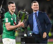 18 March 2023; Ireland captain Jonathan Sexton receives the trophy from Six Nation Non-Executive Chairman Ronan Dunne after the Guinness Six Nations Rugby Championship match between Ireland and England at Aviva Stadium in Dublin. Photo by Harry Murphy/Sportsfile