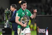 18 March 2023; James Ryan of Ireland walks the triple crown trophy to the podium after the Guinness Six Nations Rugby Championship match between Ireland and England at Aviva Stadium in Dublin. Photo by Harry Murphy/Sportsfile